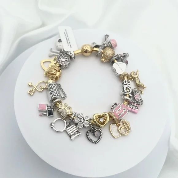 Linx Yellow Gold Bracelet with Gold Silver and Pink Nurse Girlfriend Charms